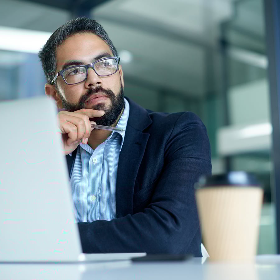 Man with glasses contemplating Global Jet Capital Operating Lease for Aircraft Financing