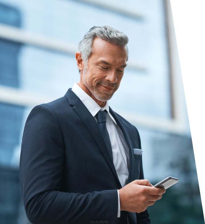 man checking phone getting update about private jet financing