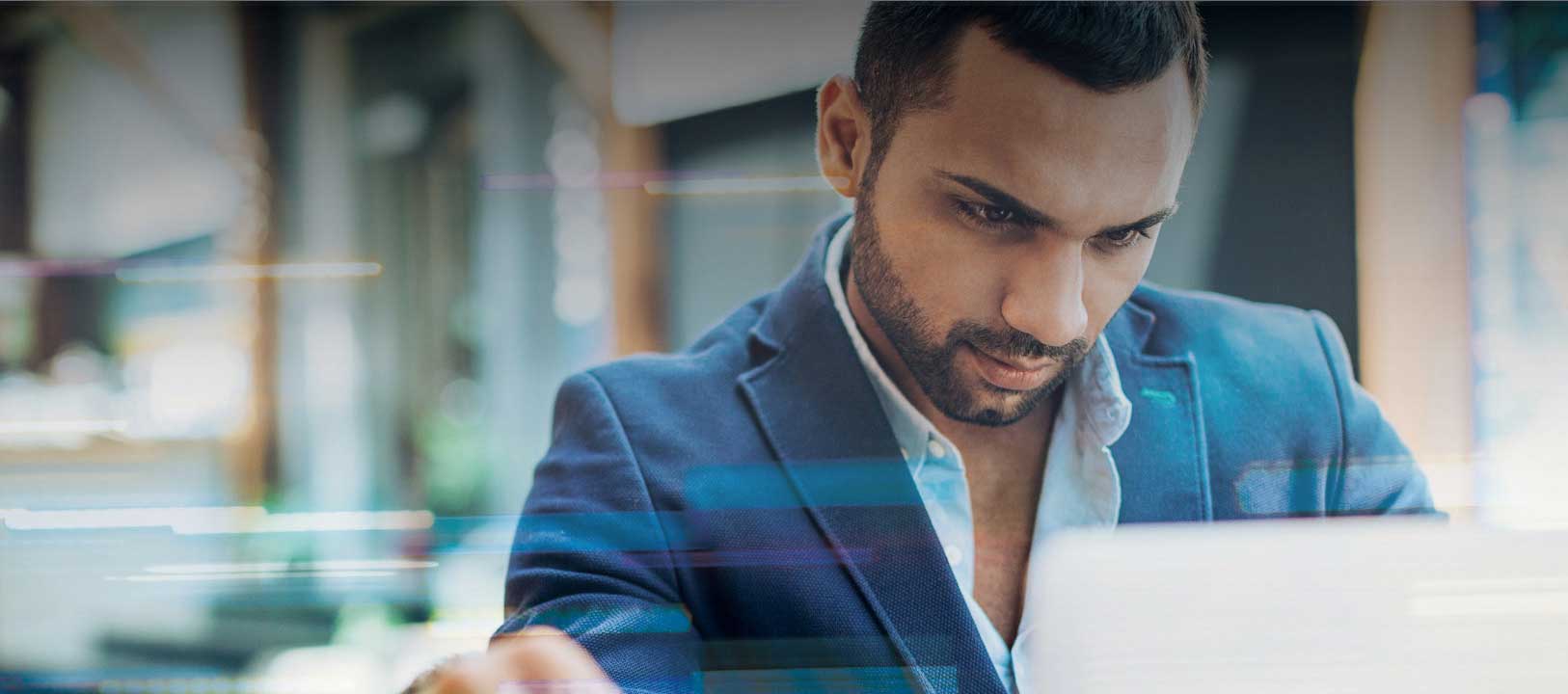 man browsing global jet capital job opportunities on laptop
